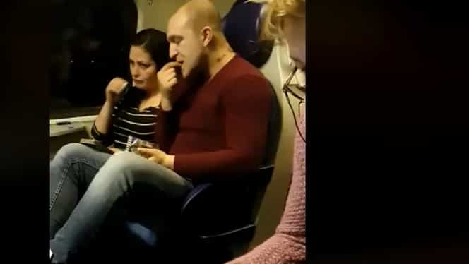 Doi români, soț și soție, filmați în timp ce spărgeau semințe în tren. Clipul a devenit viral și a atras sute de comentarii. VIDEO